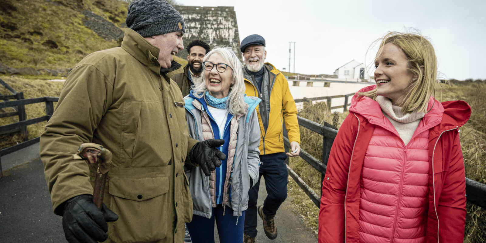 A group of people standing on a bridge