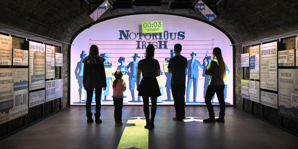 A group of people standing in front of a display