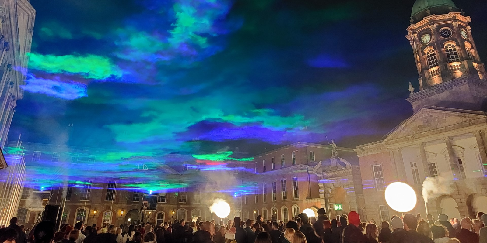 A group of people standing in front of a building