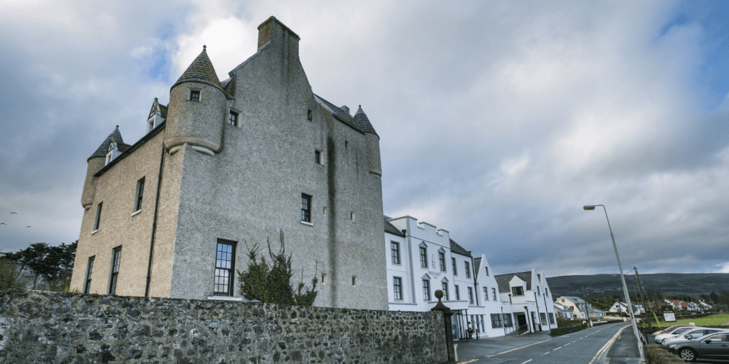 A very tall building sitting on the side of a road