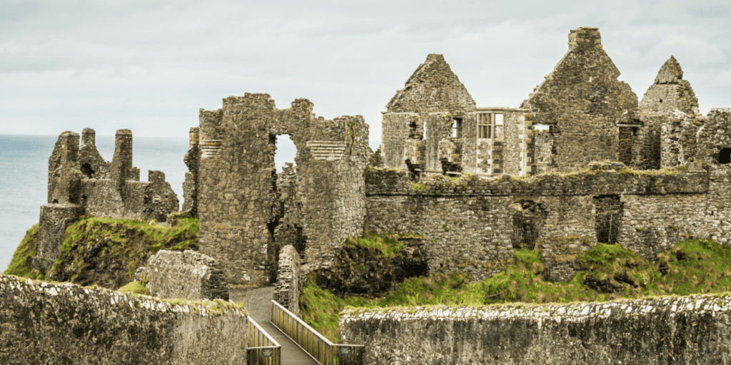 A stone castle with a walkway leading to it