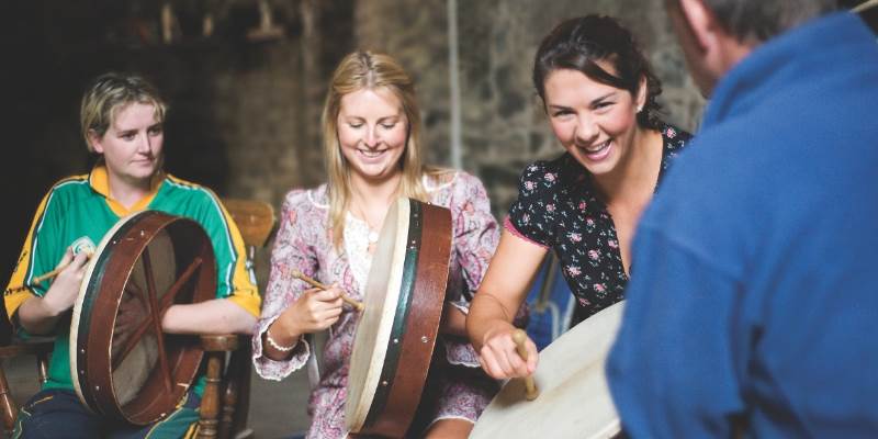 A group of people playing musical instruments together