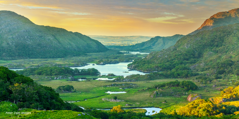 A scenic view of a valley with a river running through it