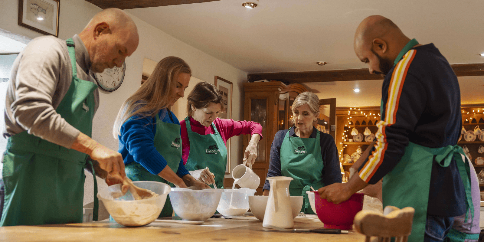 A group of people during cooking workshops at Tracey's farmhouse in Northern Ireland