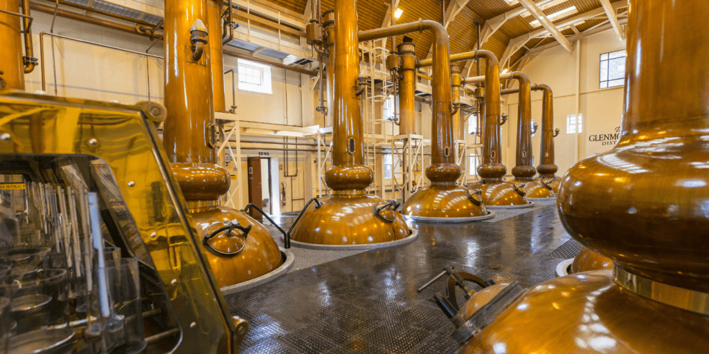 A large room filled with lots of brown tanks