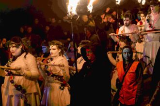 revelers celebrate beltane fire festival
