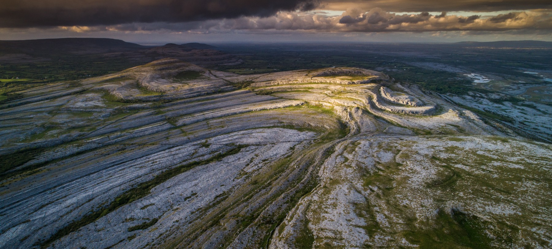 A low light aerial view of sweeping limestone formations in the Shannon region in the west of Ireland called The Burren.