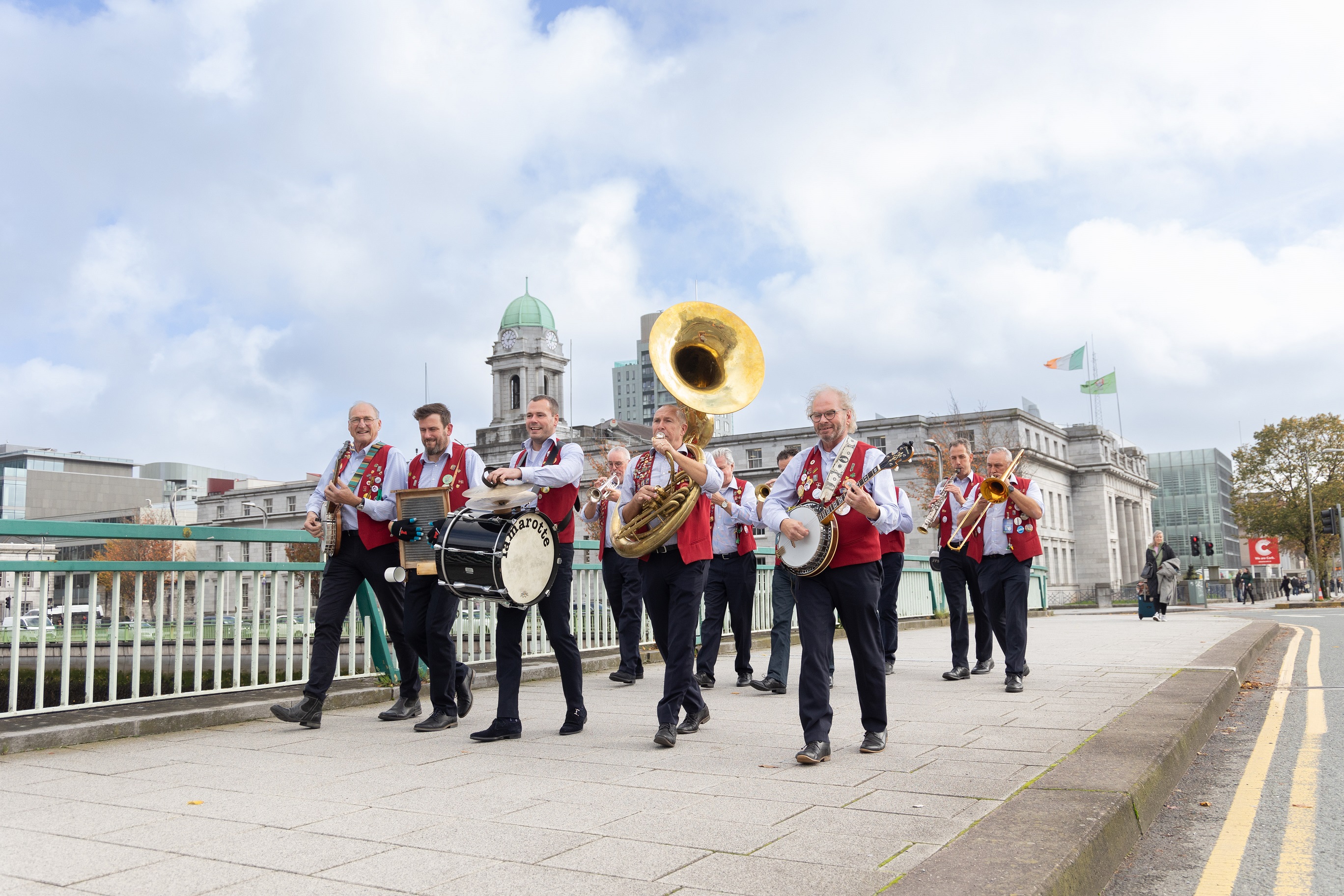 An orchestra wandering on a bridge during Cork Jazz Festival