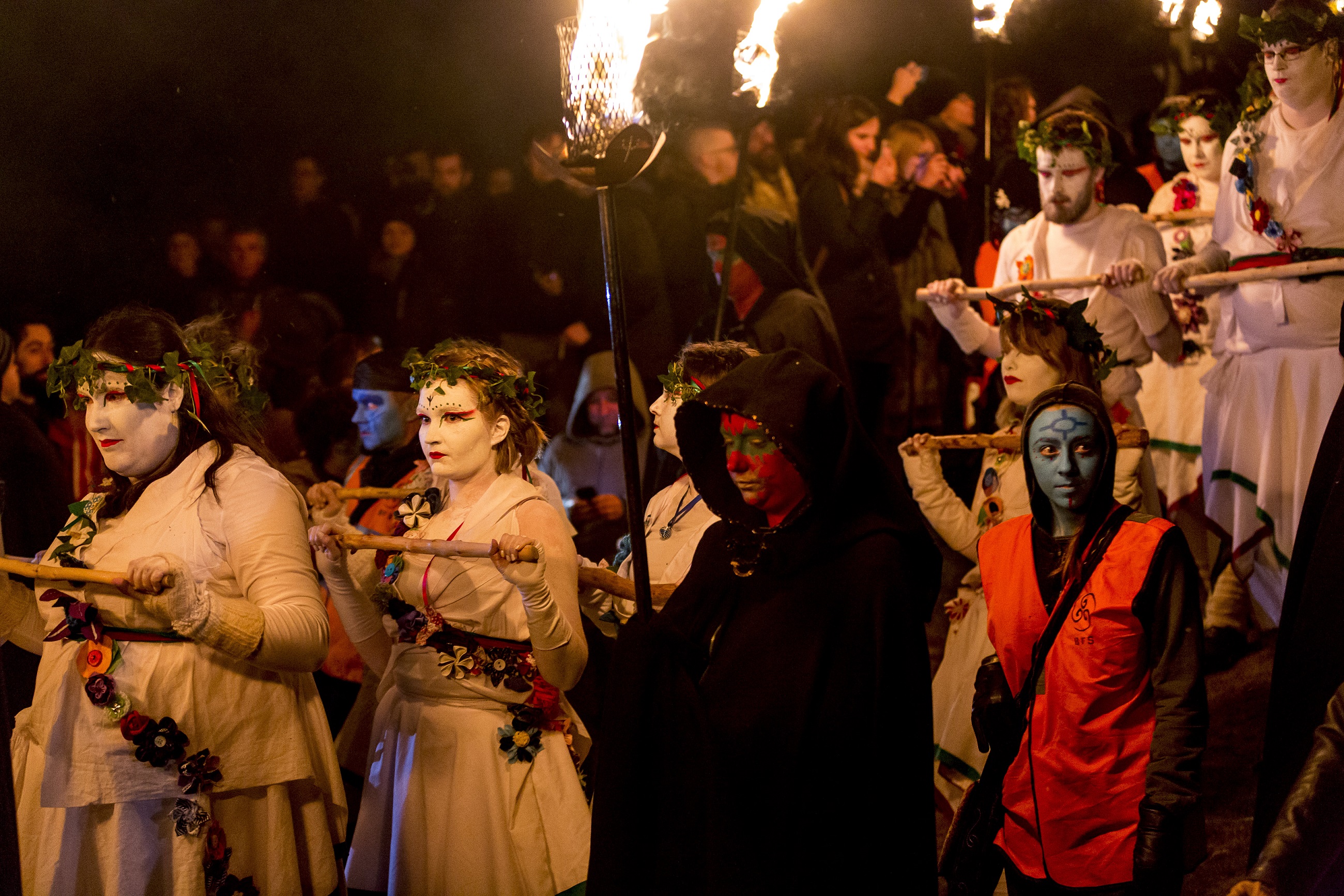 People with painted faces celebrating Beltane Fire Festival in Edinburgh