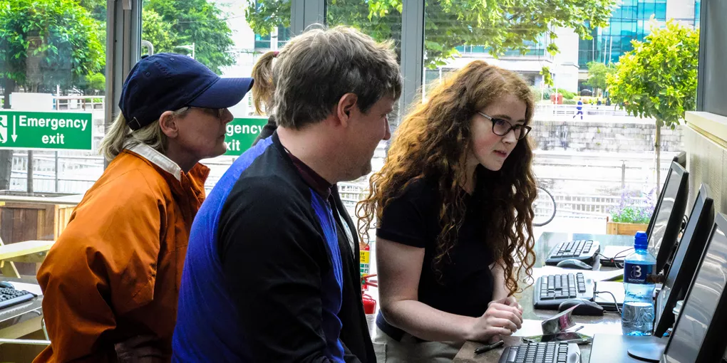 People looking at a computer