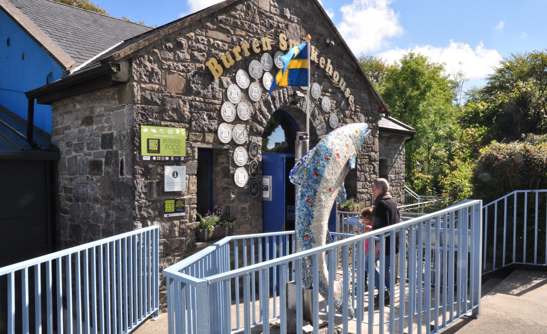 Giant salmon statue outside entrance to smokehouse