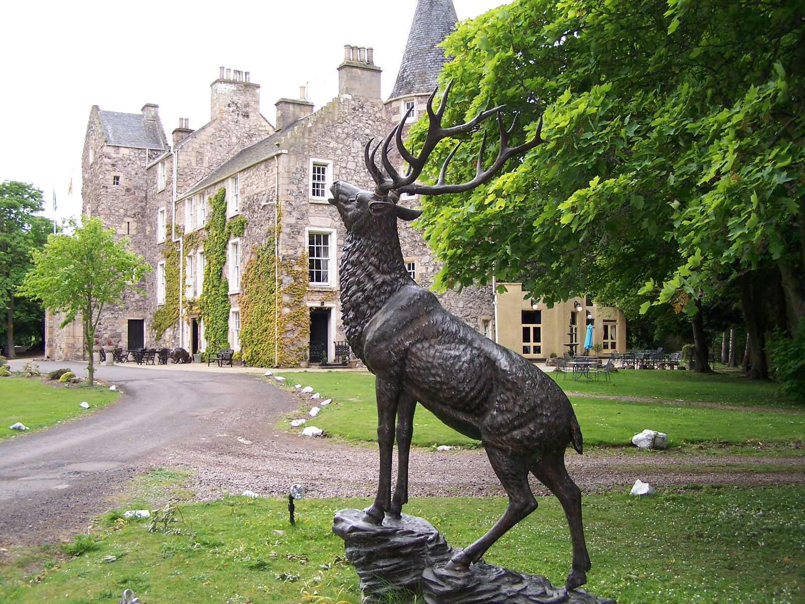 Fernie Castle Exterior with deer statue in Scotland