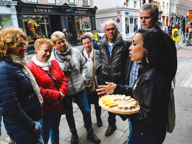 Guests sample local flavors on a food tour in Dublin, Ireland