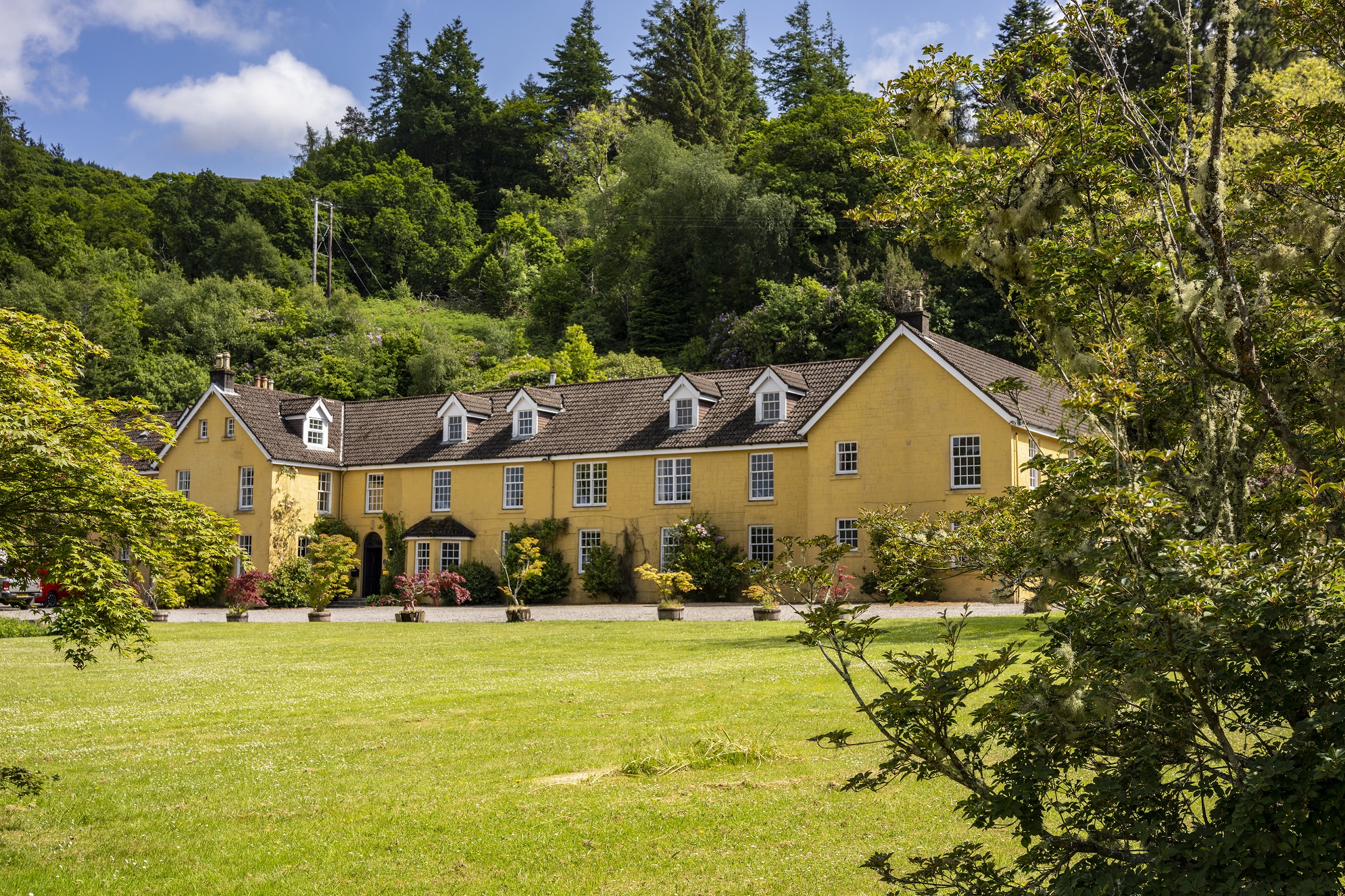 Knipoch Hotel surrounded by large garden in Oban, Scotland