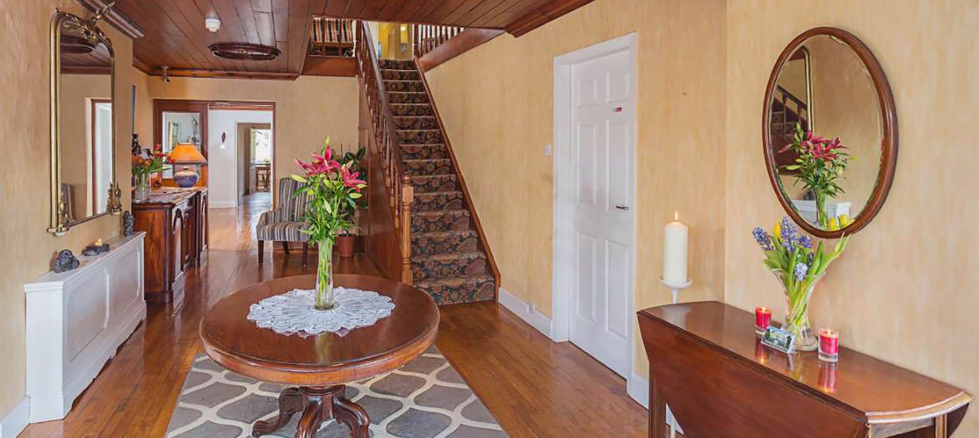 Hall with staircase in Abbey Lodge in Killarney, Ireland 