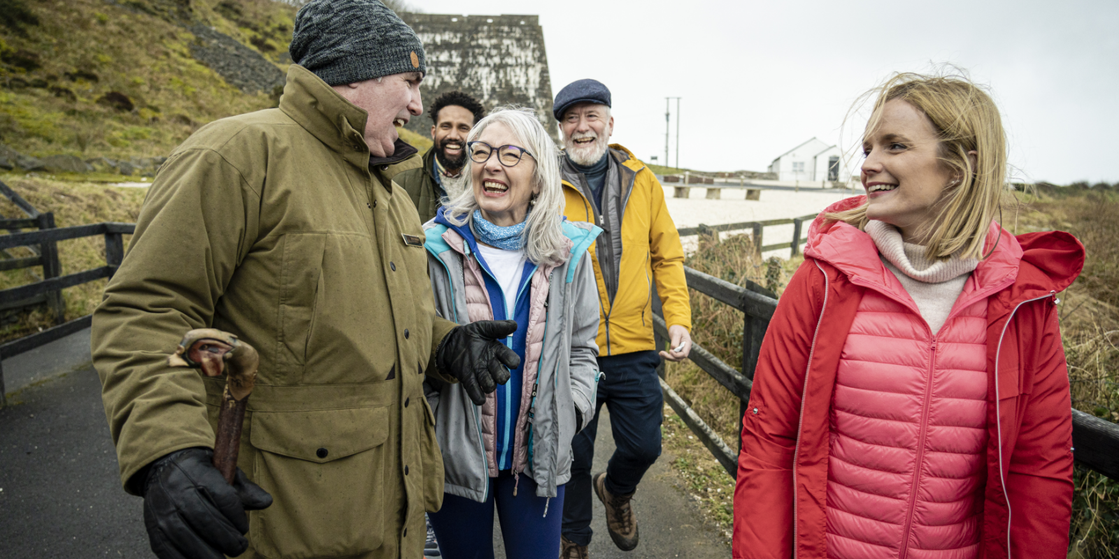 A group of people standing on a bridge