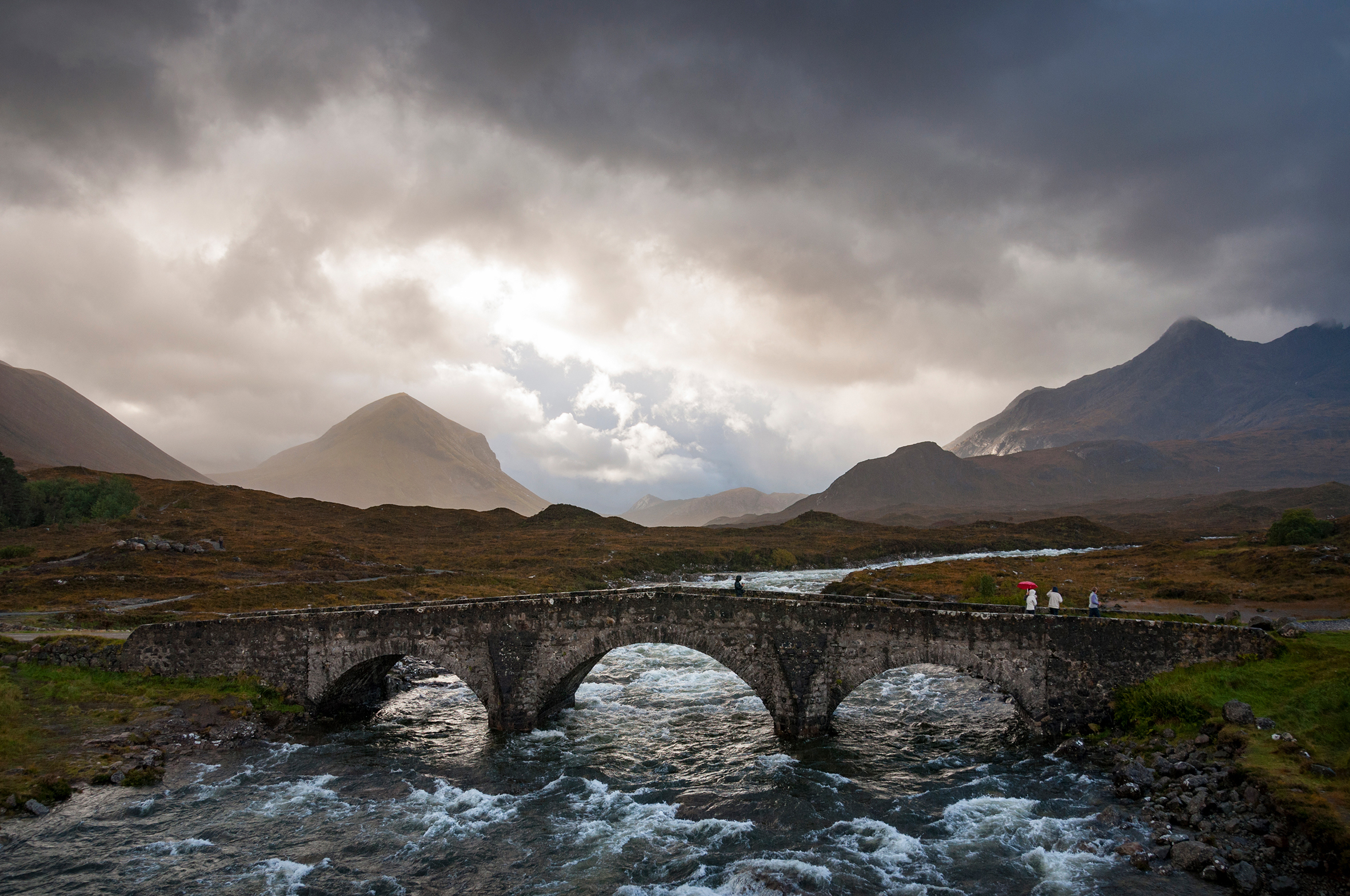 Tourists On The Bridge At Sligachan, Isle Of Skye, Scotland