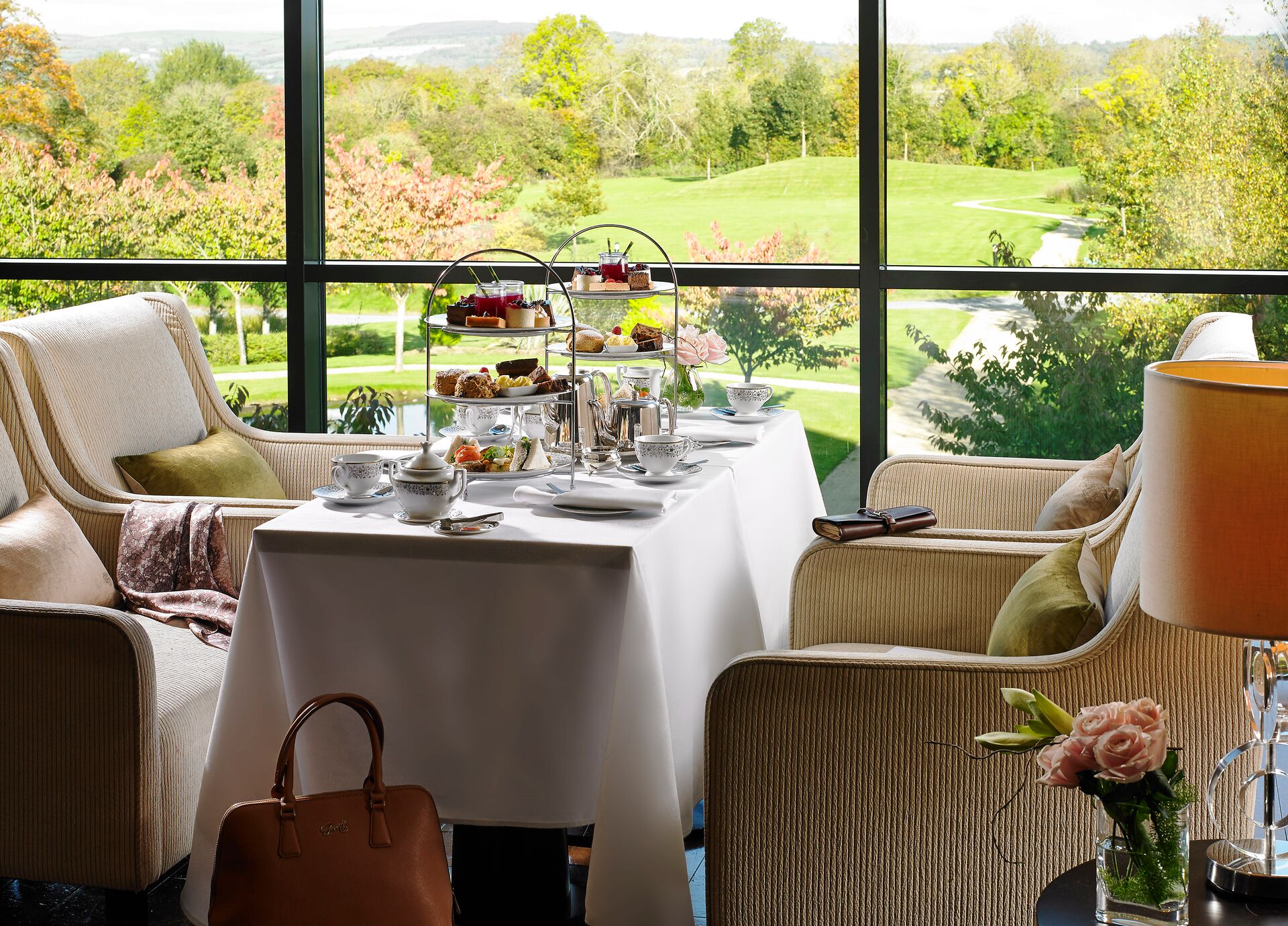 Afternoon Tea set up overlooking a view of a field