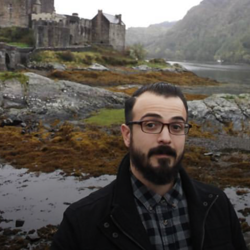 Traveler at Eilean Donan Castle, Scotland