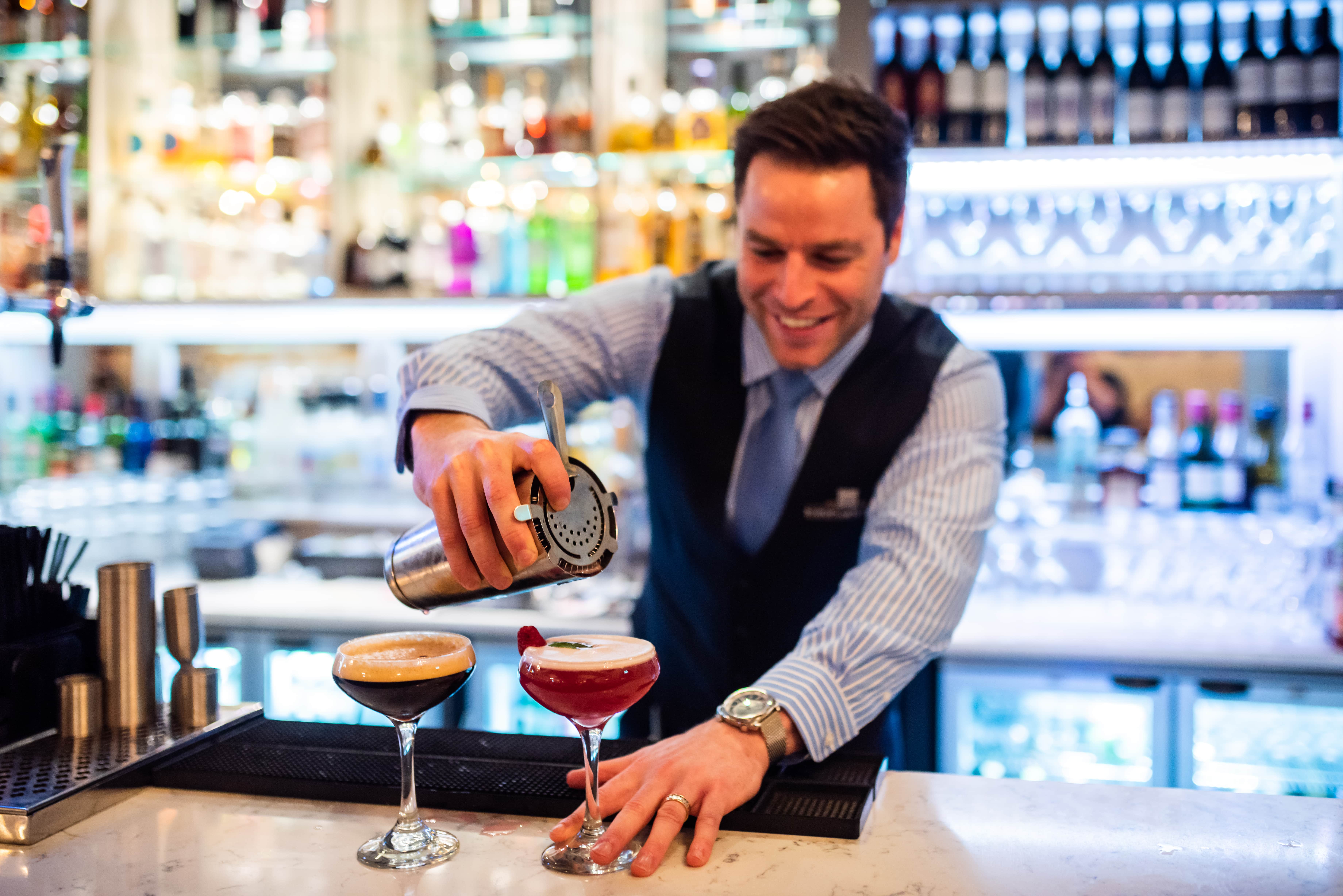 A bartender preparing drinks at Bishop's Gate in Northern Ireland