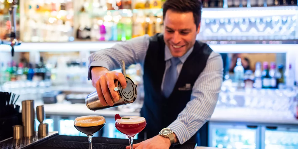 A bartender preparing drinks at Bishop's Gate in Northern Ireland