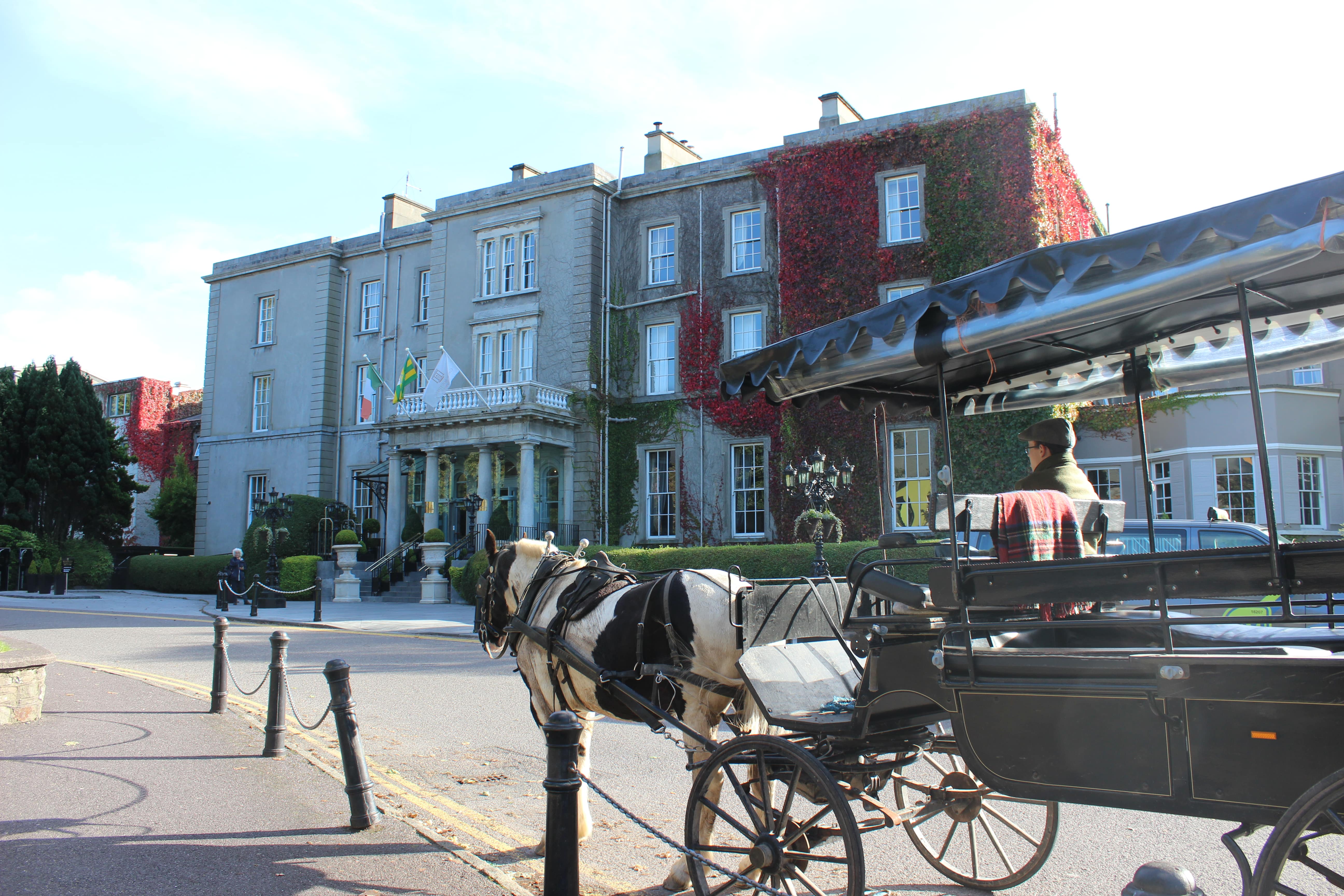 XA horse drawn carriage in front of the Great Southern Hotel in Killarney