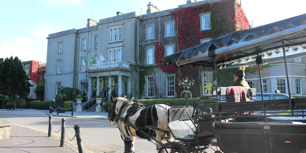 XA horse drawn carriage in front of the Great Southern Hotel in Killarney