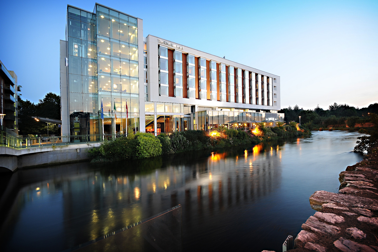 External view of the river lee hotel on the river at dusk