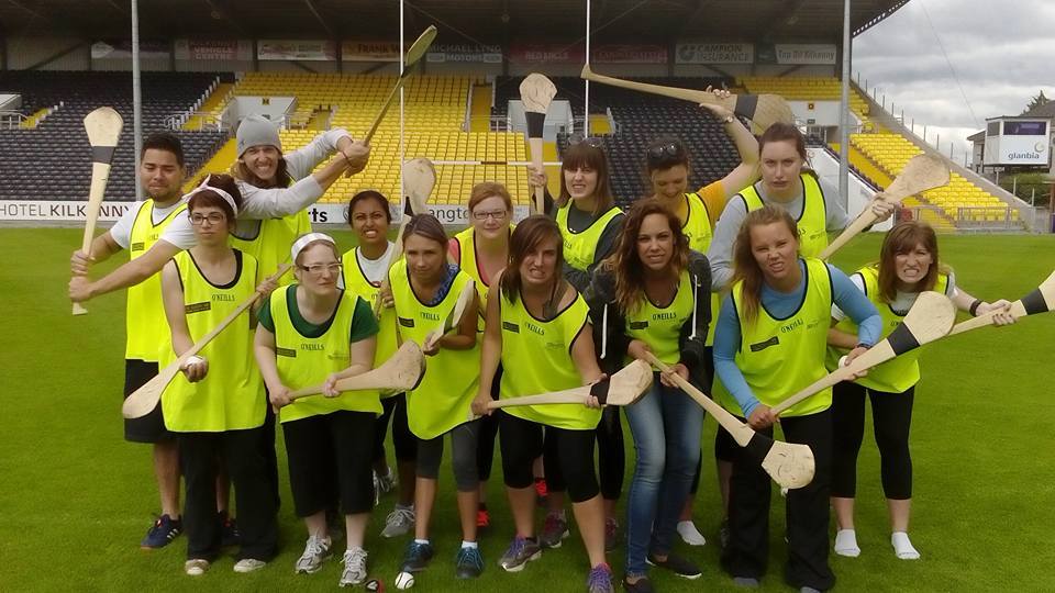 Travellers doing sports activities on Kilkenny Hurling Experience tour