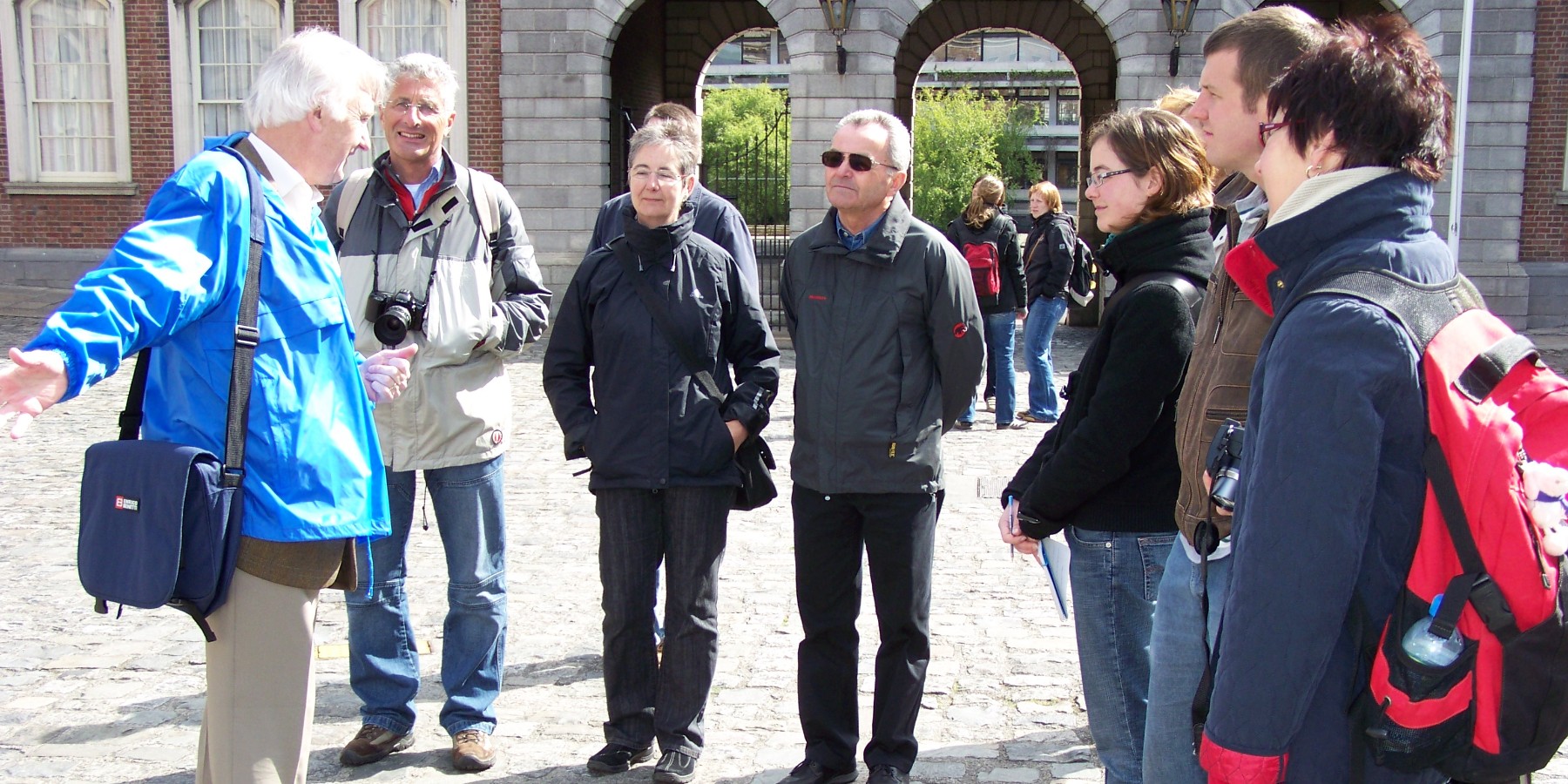A group of tourists on walking tour in Dublin Castle