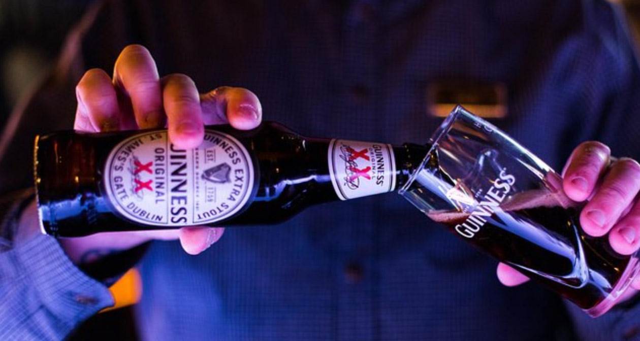 A person pouring Guinness beer at Guinness Storehouse in Dublin