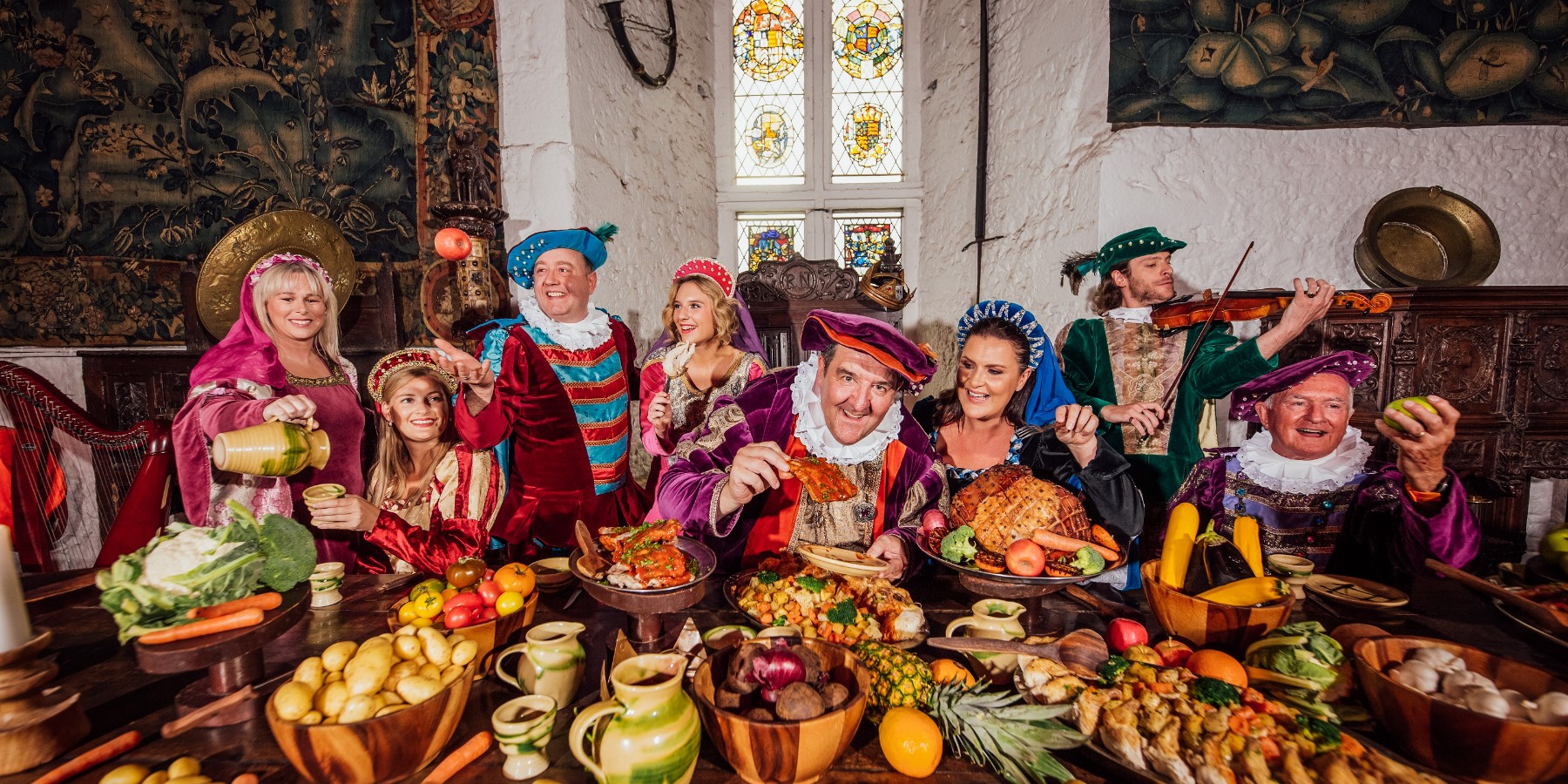 A group of people in medieval clothes at the Bunratty Banquet 