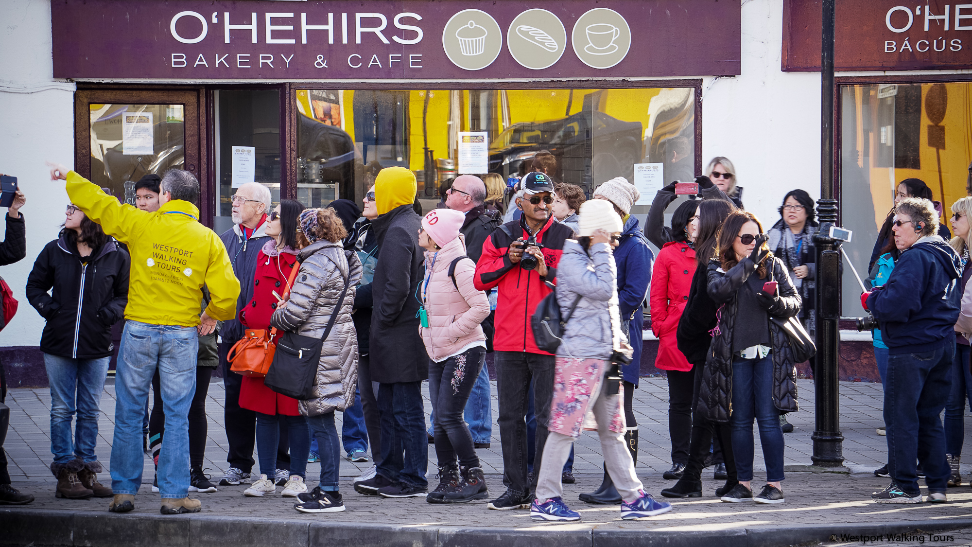 Group of tourists in front of bakery in Westport