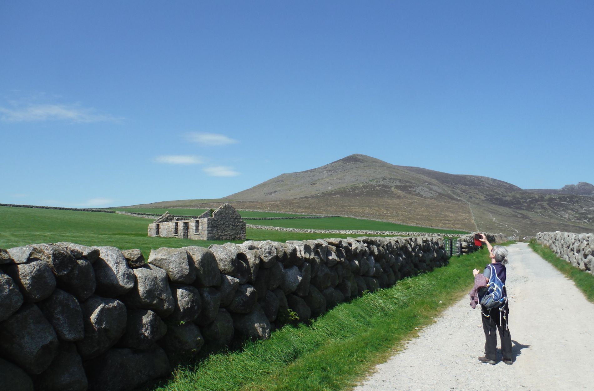Woman photographing mountain views
