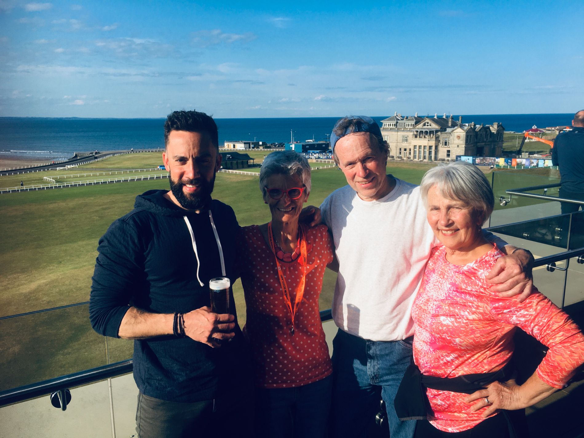 People posing on the background of lawn and water