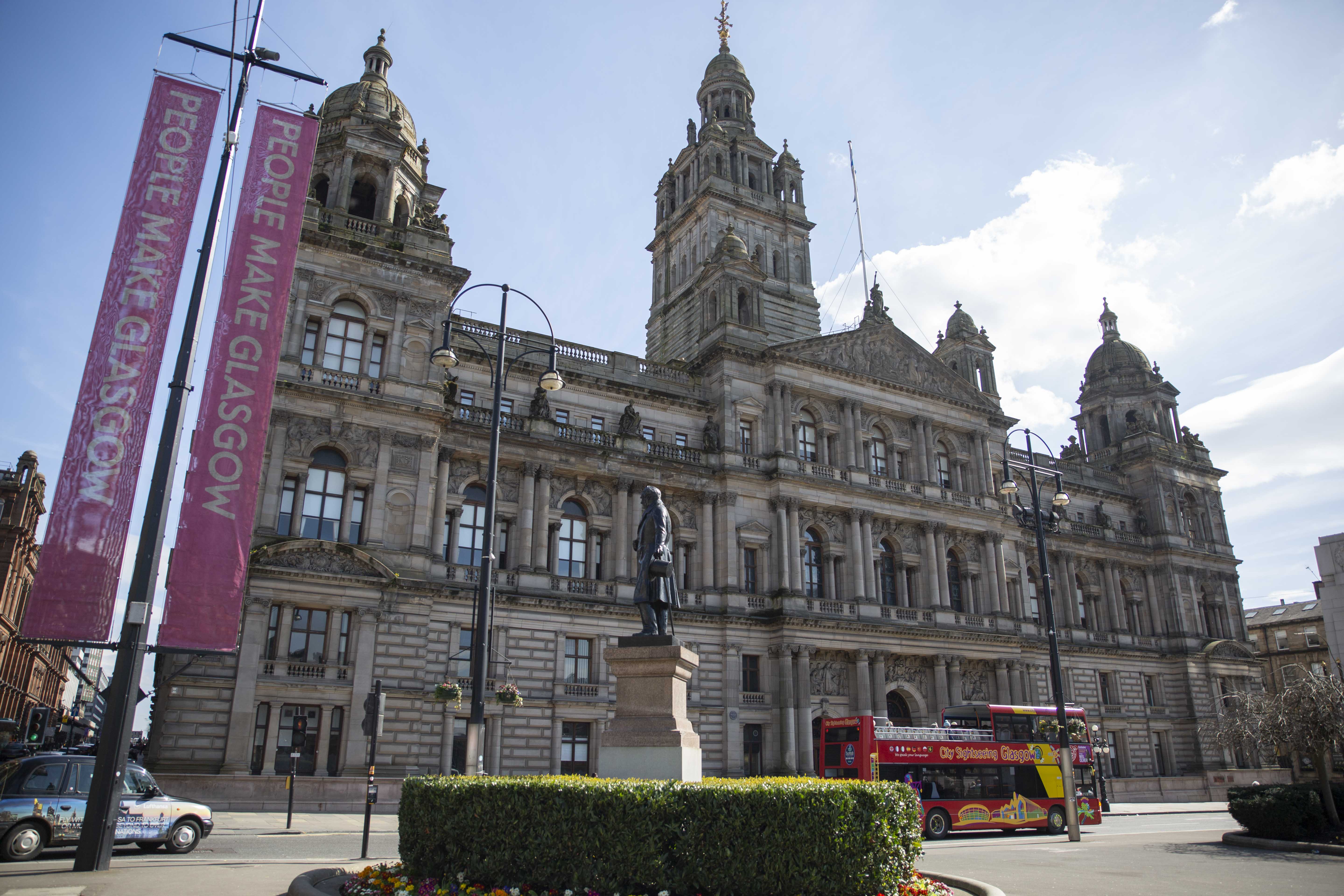Bus in front of the building in Glasgow
