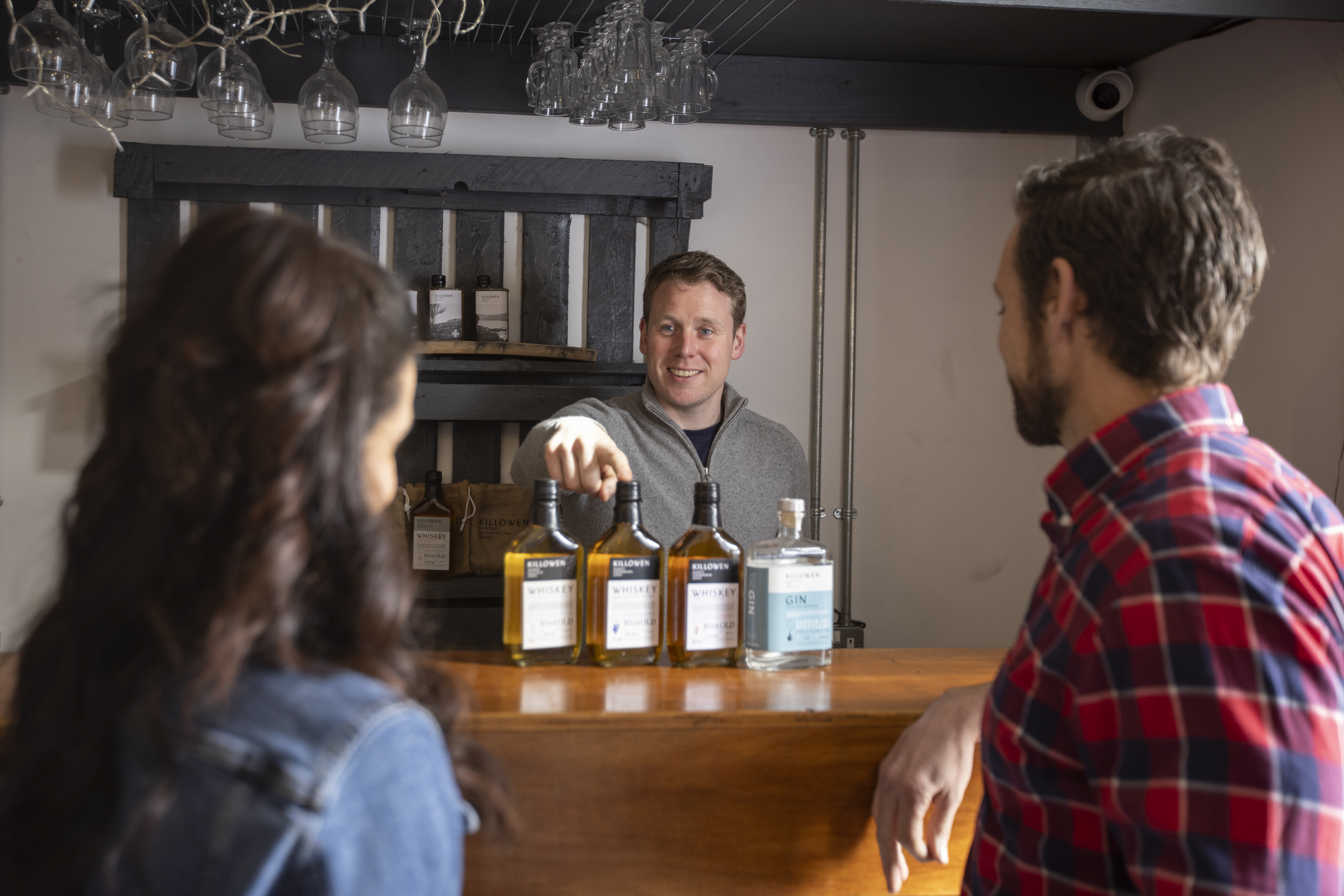 Guests sample whiskey at Killowen Distillery on a tour and tasting experience in Co Mayo Ireland