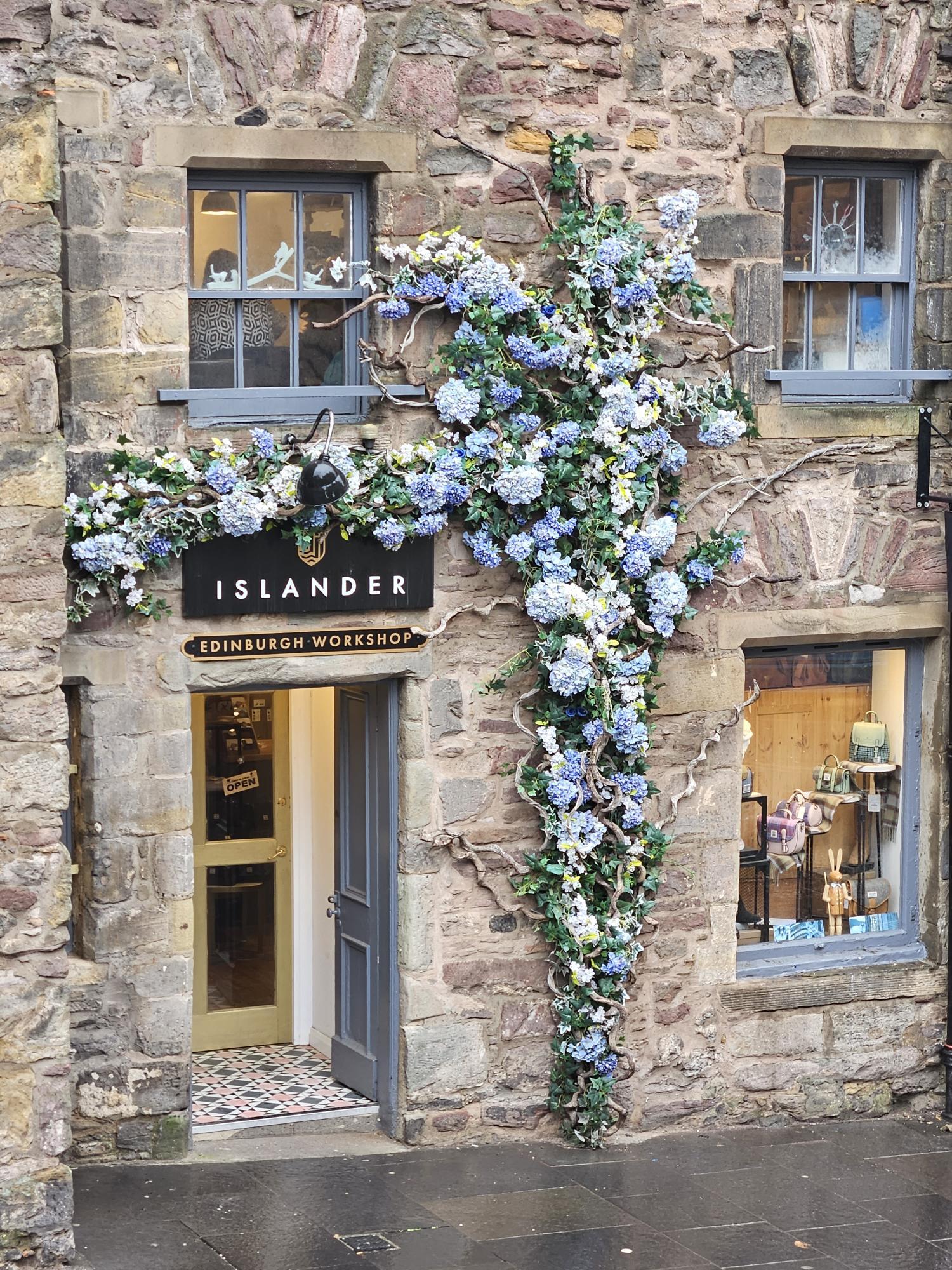 Entrance of Islander bag workshop with flowers around