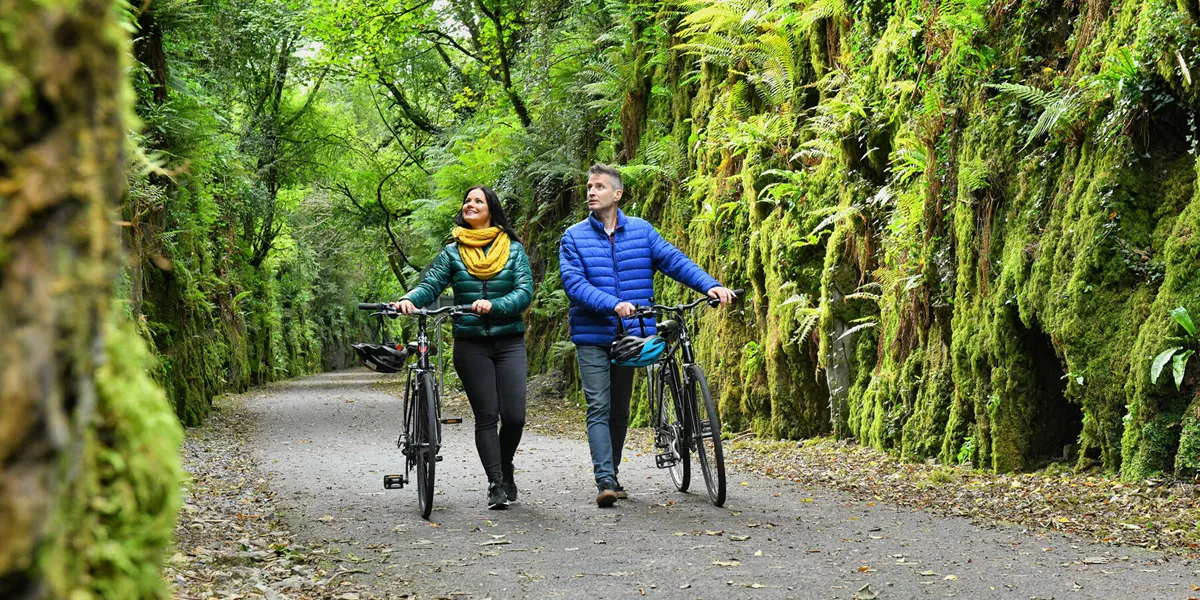 Couple Cycling Along The Waterford Greenway Web Size