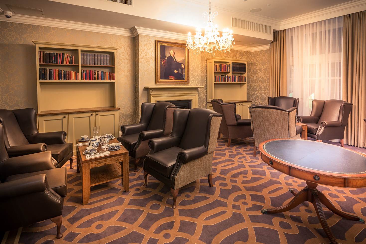 A living room filled with furniture and a chandelier