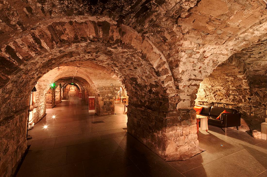 A tunnel with a couch and a table inside