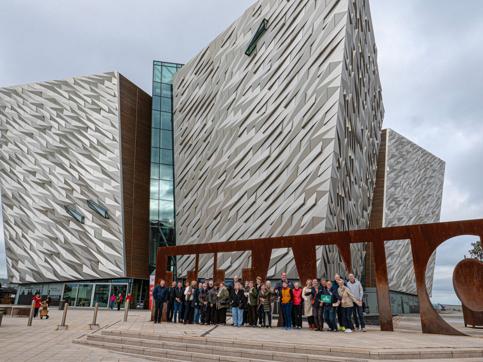 A group of people standing in front of a building