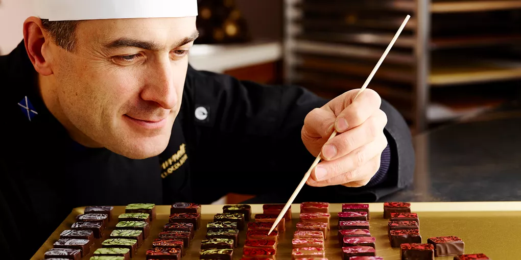 Iain Burnett shares his creations with guests during a private chocolate tasting experience in Scotland.