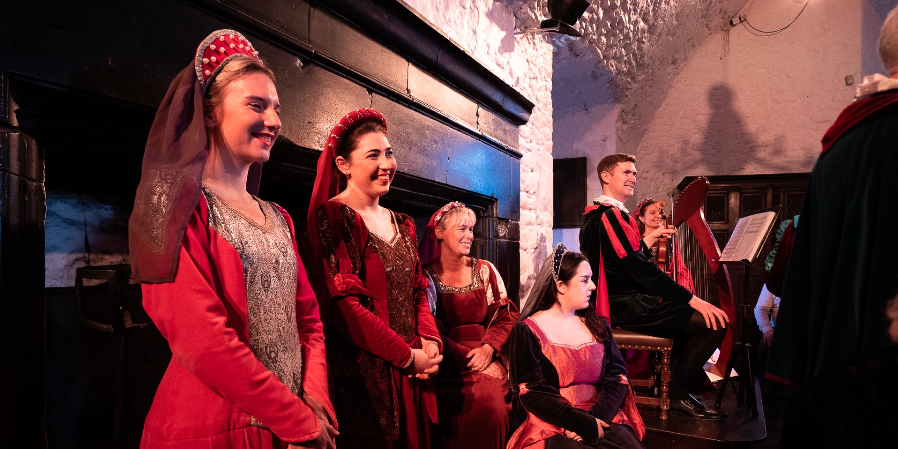 People wearing medieval clothes during Bunratty Banquet in Shannon, Ireland