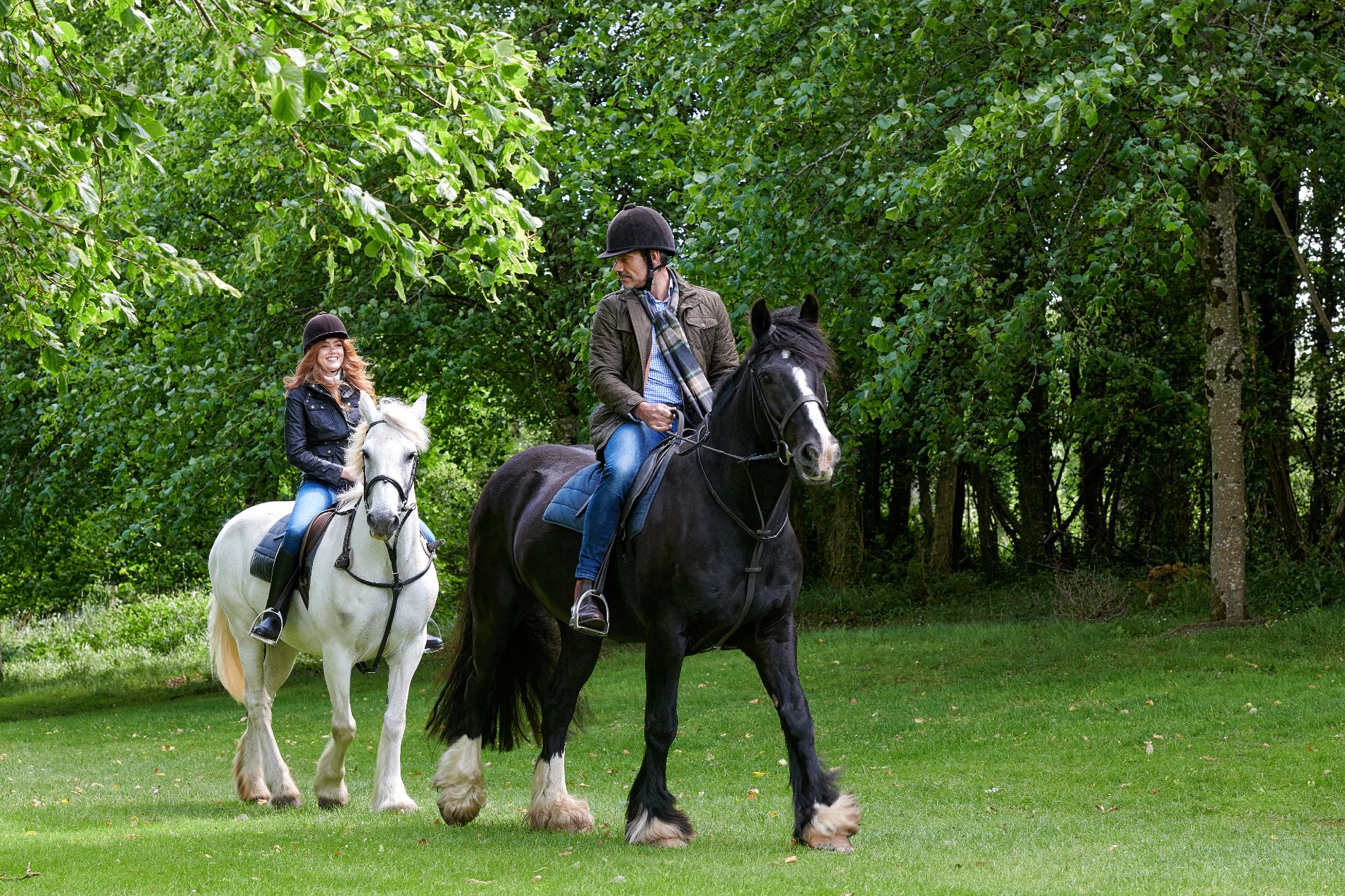 Couple Horse riding around Dromoland Castle in Ireland