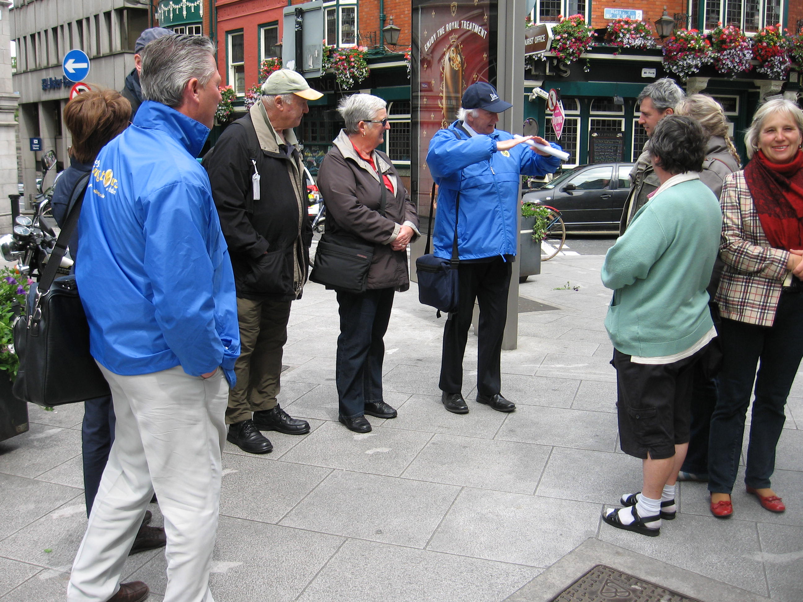 A group of people on a walking tour in Dublin with tour guide Pat Liddy