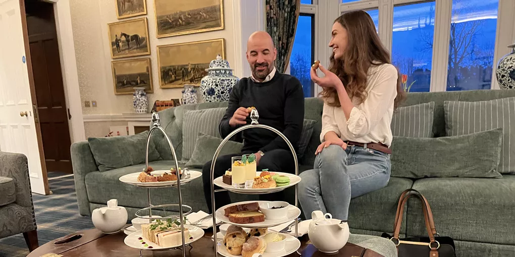 A couple enjoying their afternoon tea at SCHLOSS Roxburghe in Kelso, Scotland