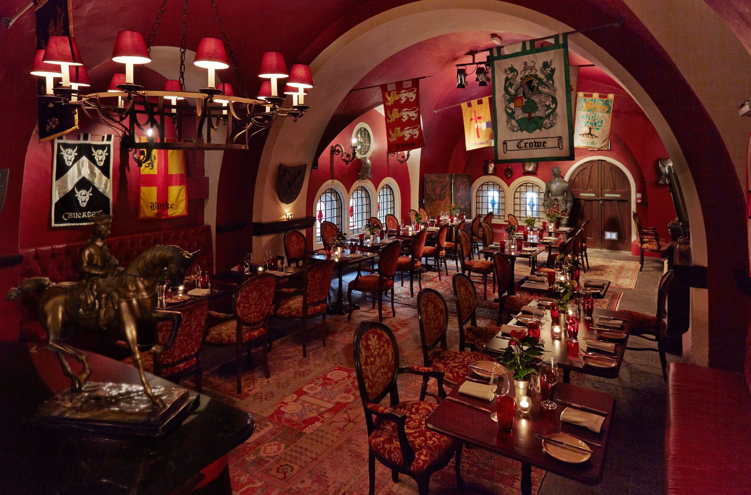 Interior with tables in Ashford Castle Dungeon Bar
