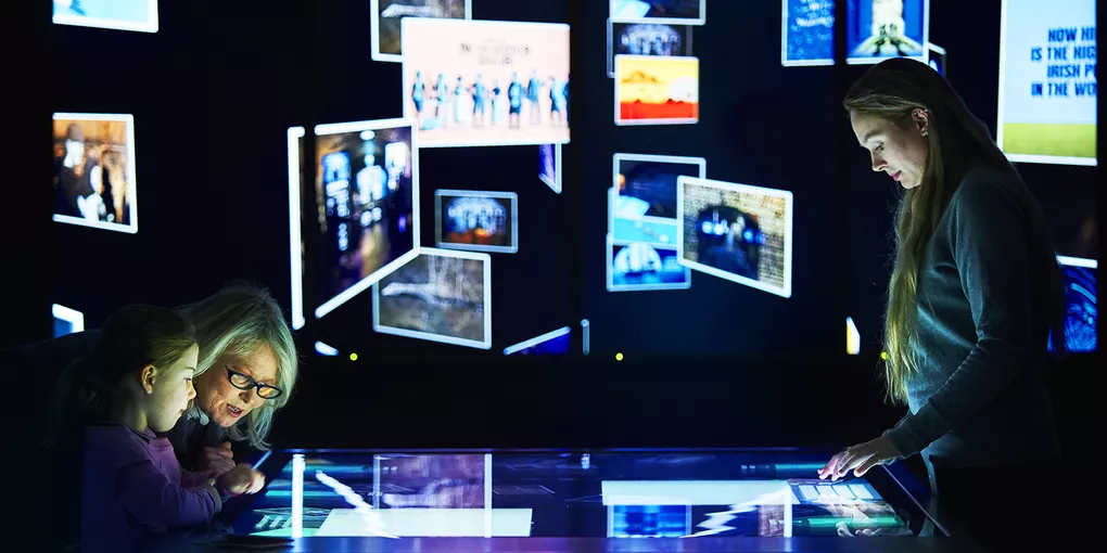 Visitors view the Connections Gallery at EPIC, The Irish Emigration Musuem in Dublin Ireland