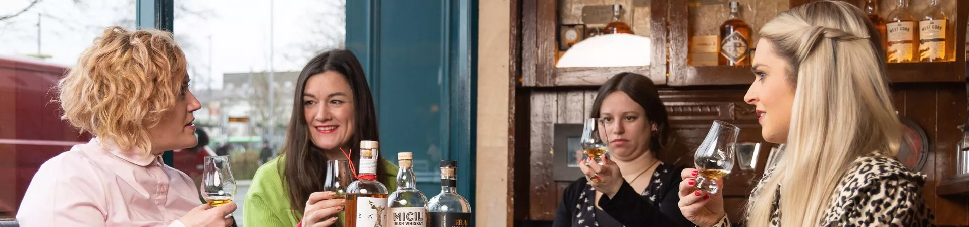 Four women tasting whisky